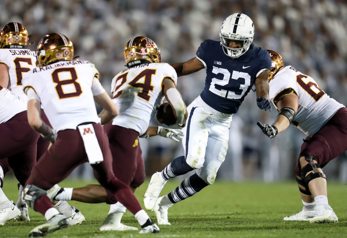 Oct 22, 2022; University Park, Pennsylvania, USA; Penn State Nittany Lions linebacker Curtis Jacobs (23) pressures Minnesota Golden Gophers running back Mohamed Ibrahim (24) during the third quarter at Beaver Stadium. Penn State defeated Minnesota 45-17. Mandatory Credit: Matthew OHaren-USA TODAY Sports  